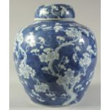A LARGE CHINESE BLUE AND WHITE PORCELAIN PRUNUS JAR AND COVER, the base with character mark, 29cm