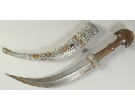 A VERY FINE 19TH CENTURY OTTOMAN KURDISH SILVER AND GOLD MOUNTED DAGGER, with a large horn hilt, scabbard bearing maker's sig