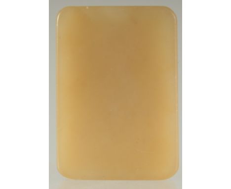 A CHINESE YELLOW JADE RECTANGULAR PENDANT, 5cm x 3.5cm.