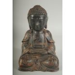 A CHINESE BRONZE SEATED BUDDHA, with traces of gilt, 22cm high.