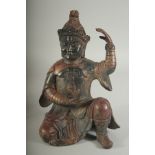 A CHINESE BRONZE KNEELING FIGURE, in ceremonial attire, the reverse with character mark, 24cm high.