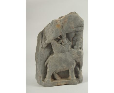 A RARE GANDHARA CARVED GREY SCHIST TILE FRAGMENT, depicting an elephant and rider, 19.5cm x 13cm.