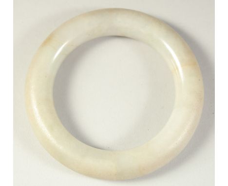 A FINE EARLY CHINESE JADE BANGLE.