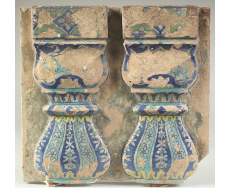 A RARE 18TH CENTURY NORTH INDIAN MUGHAL GLAZED POTTERY TILE, depicting two pillars, 33cm x 30cm.