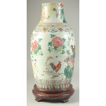 A LARGE CHINESE FAMILLE ROSE PORCELAIN VASE, on hardwood stand, painted with cockerels and