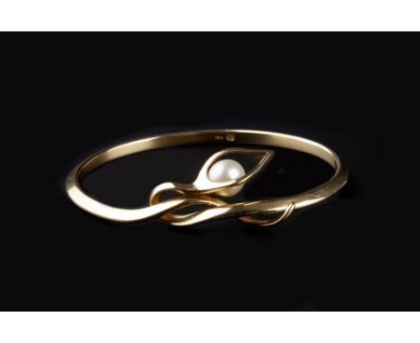 Georg Jensen Cultured pearl set bangle of entwined sinuous form signed and stamped '750' 6.8cm diameter.