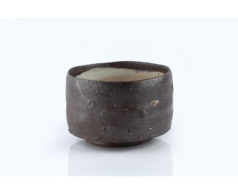 Marcus O'Mahony (b.1952) Footed bowl pearl brushed porcelain slip, dark glaze 10.8cm high, 16.4cm diameter. Provenance: Alpha