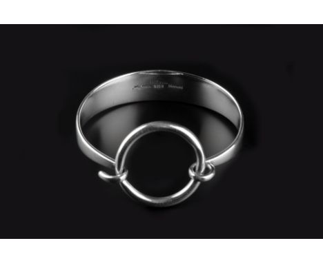 Hans Hansen (Danish, 20th Century) Silver bangle of tapered form with hoop clasp signed and stamped '925S Denmark' London imp