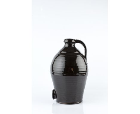 Leach Pottery Cider flagon dark glaze, looped handle impressed pottery seal 34cm high.