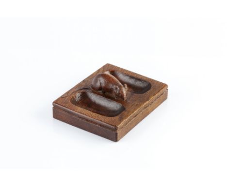 Robert Thompson of Kilburn (1876-1955)  Mouseman desk tray oak, with two recesses flanking the mouse  carved mouse signature 