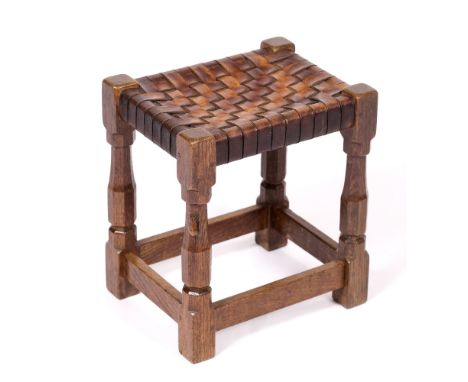 Robert Thompson of Kilburn (1876-1955)  Mouseman stool  oak, with woven tan leather top  carved mouse signature  38cm high, 3