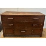 An oak sideboard with two long drawers over one central drawer flanked by two cupboards AF (H74cm