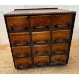 An industrial style bank of drawers (H50cm W52cm D51cm)