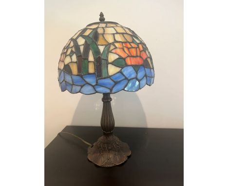 Tiffany style lamp with scenes of water and flowers on glass shade 