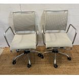 Two chrome office chairs on castors