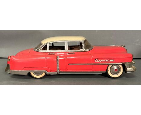 A Gama 300 tinplate 1950's friction powered Cadillac in pink 