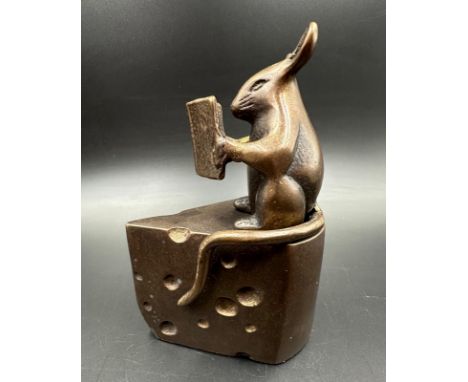 A pair of bronze mouse themed bookends, depicting reading mice sat on wedges of cheese.