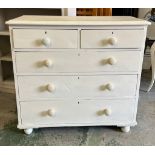 A painted white pine chest of drawers (H92cm W98cm D45cm)