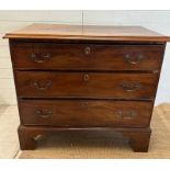 A mahogany George III style chest of drawers comprising of three long drawers with brass back