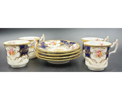 A set of four Coalport tea cups and saucers