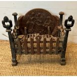 A cast iron fire grate (H42cm W43cm D25cm)