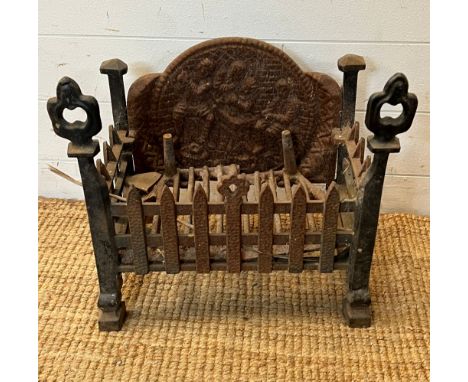 A cast iron fire grate (H42cm W43cm D25cm)