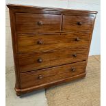 A mahogany chest of drawers with knob handles (H124cm W119cm D52cm)