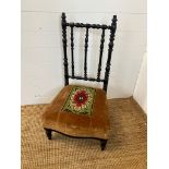 An Elm parlour chair with needlework seat pad