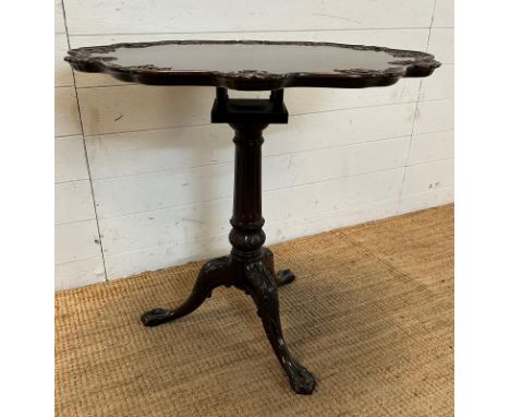 A Chippendale style mahogany tilt topped bird cage table, tripod legs ending in claw and ball feet (H71cm Dia74cm)