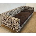Three seater sofa with pattern fabric and brown cushion seat pads by MOOOI (H60cm W220cm D86cm