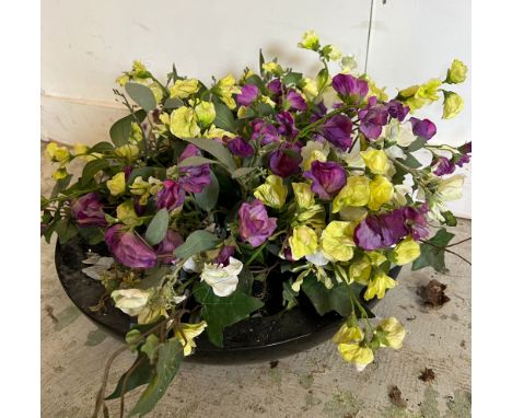 A low circular garden planter with artificial sweet pea flowers (H12cm Dia42cm)