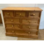 A pine eight drawer chest of drawers (H87cm W101cm D44cm)