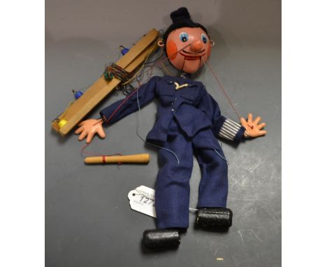 Policeman - Pelham Puppet SS Range, round wooden head, painted features, blue eyes, moulded composite hands,  wearing a blue 