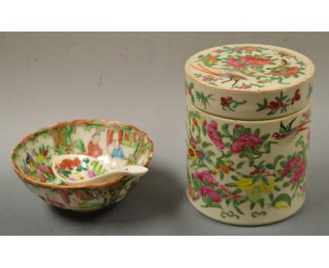 A Chinese Famille Rose cylindrical jar and cover; a later bowl and spoon (3)