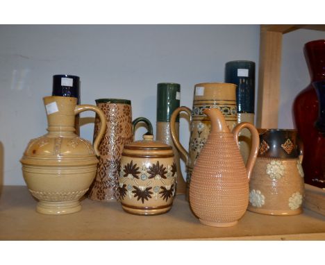 A Doulton Lambeth salt glazed stoneware ovoid jug, applied with quatrefoil motifs and stiff leaves, inscised banding, 20cm, i
