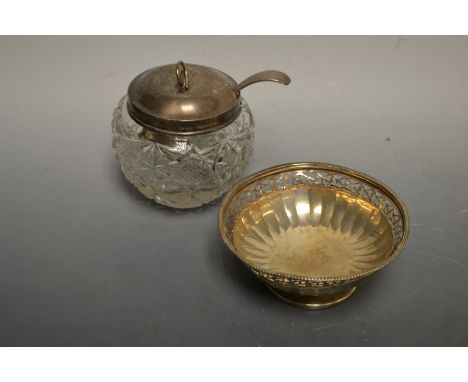 A pierced silver bon-bon dish; Birmingham 1903; a silver mounted preserve jar; a silver condiment ladle (3)