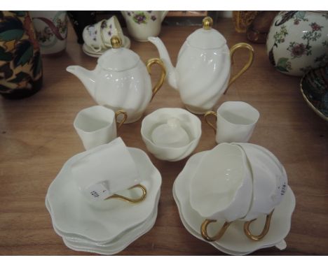 A vintage tea / coffee service by Coal port in a fine china twisted shell design