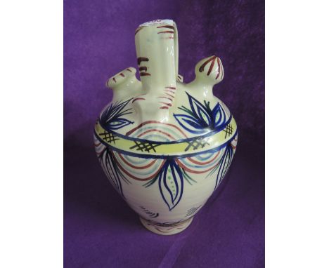 A vintage ceramic water vessel jug in a Mediterranean Quimper style