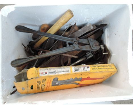 A box of various tools including files, bolt croppers, etc