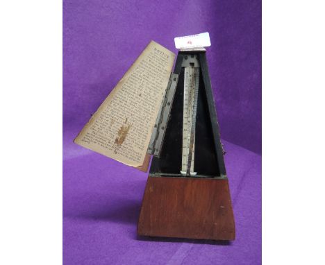 A vintage treen bodied Metronome De Suisse De Maelzel 