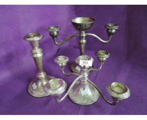 A selection of vintage plated candle sticks