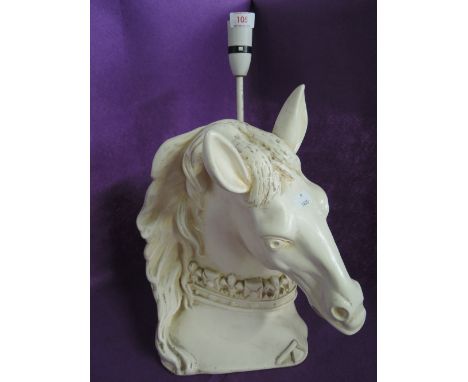 A large plaster cast horse head lamp with fleur de lis decoration