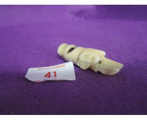 A 19th century dog whistle in the form of hounds head from carved bone a hunt related item