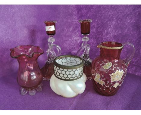 A selection of early glass wares including blown ruby candle stick pair and Venetian style jug