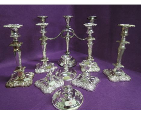 A selection of vintage plated candle sticks and candelabra as new with box