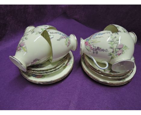 A selection of vintage tea cups and saucers by Foley Bone china 
