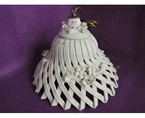 A vintage ceramic light shade 