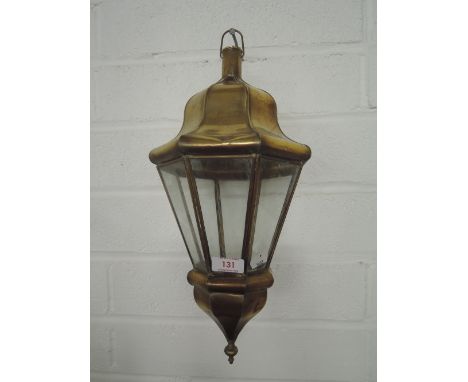A vintage gas lamp style light fitting with brass and glass 
