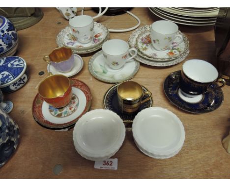 A selection of miniature tea cups and saucers 