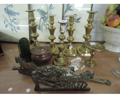 A selection of vintage brass candle sticks and fire side ornaments etc